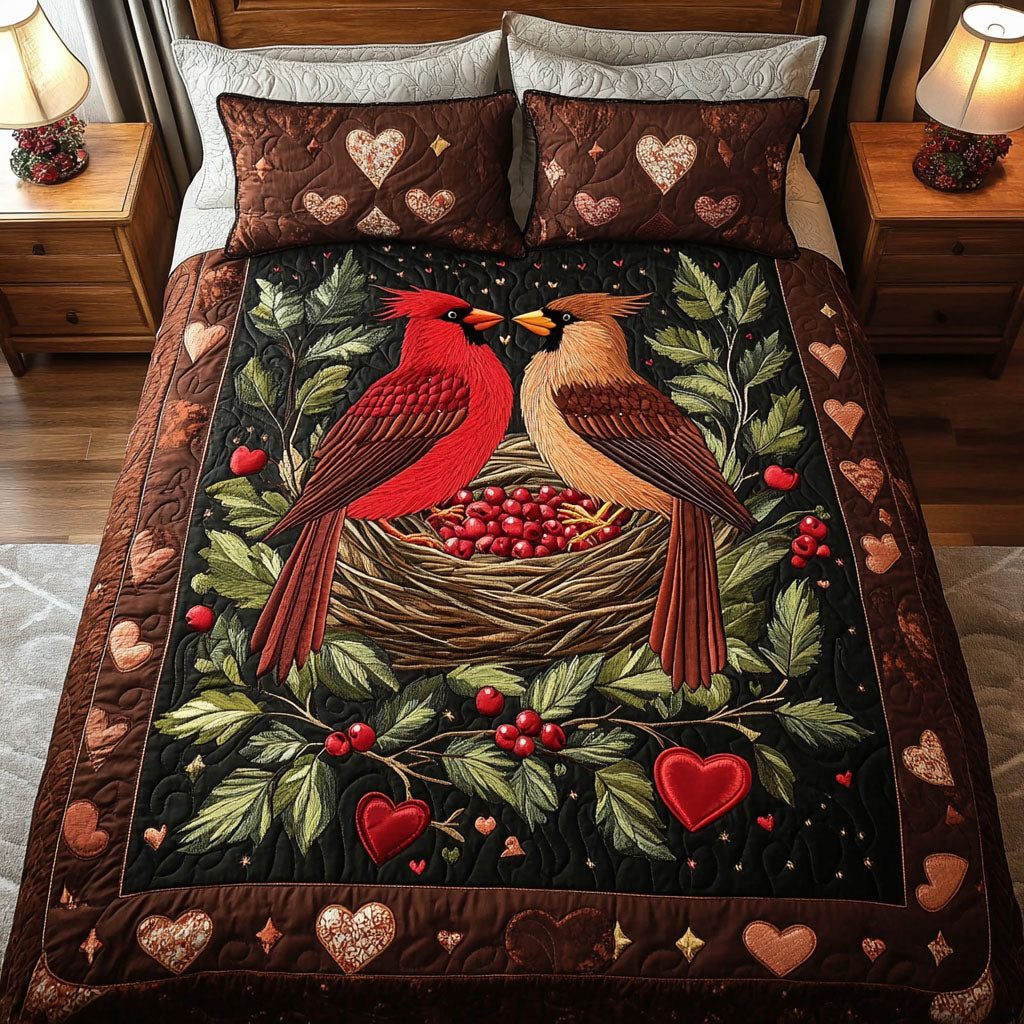 Cardinal Heart Nest quilted 3-piece bedding set on a made bed with two matching pillow shams