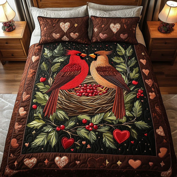 Cardinal Heart Nest quilted 3-piece bedding set on a made bed with two matching pillow shams