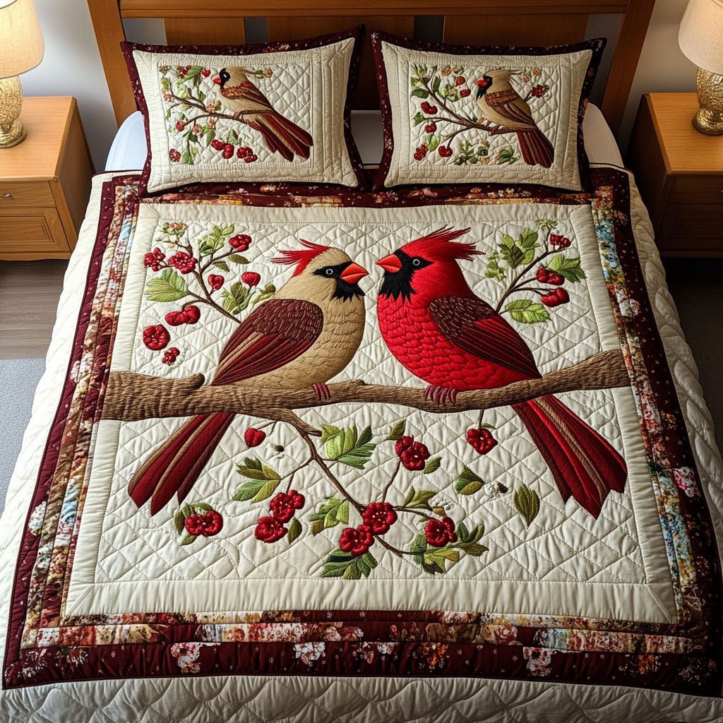 Cardinal Hearts quilted 3-piece bedding set on a made bed with two matching pillow shams