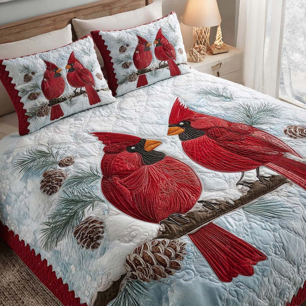 Cardinal Nest quilted 3-piece bedding set on a made bed with two matching pillow shams