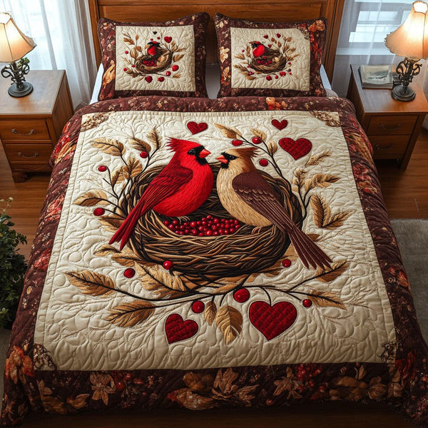 Cardinal Pair Harmony quilted 3-piece bedding set on a made bed with two matching pillow shams