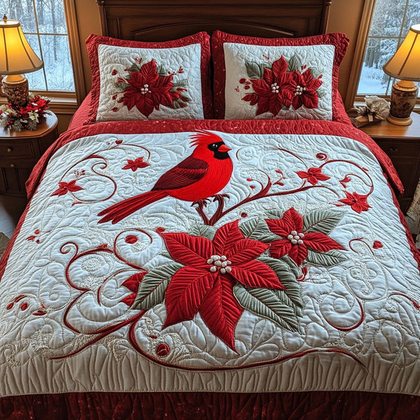 Cardinal Poinsettia Delight quilted 3-piece bedding set on a made bed in a winter-styled bedroom