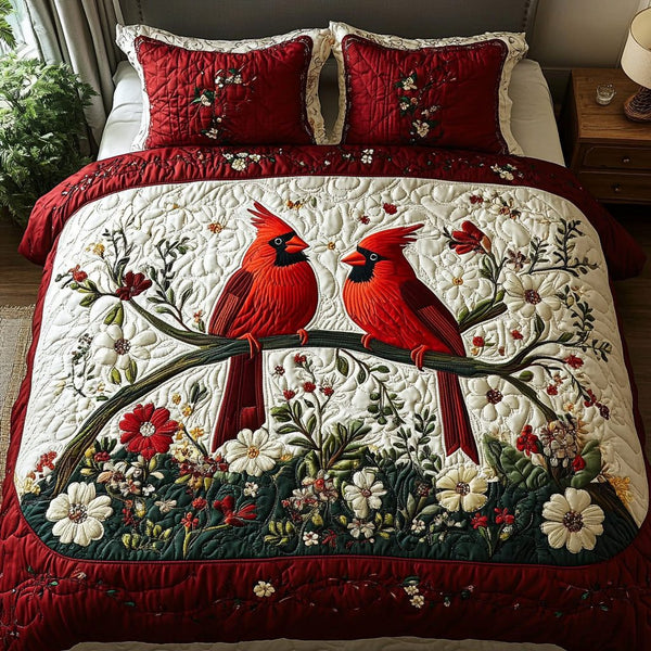 Cardinal quilted 3-piece bedding set on a made bed with two matching pillow shams