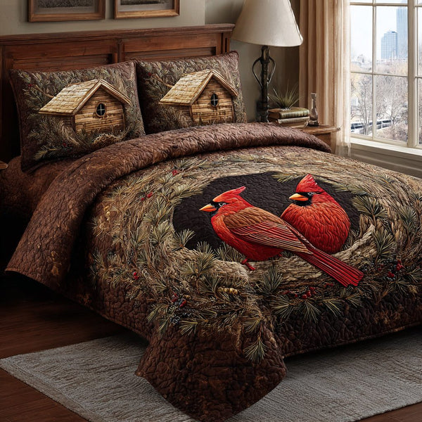 Cardinal Spirit quilted 3-piece bedding set on a made bed with two matching pillow shams