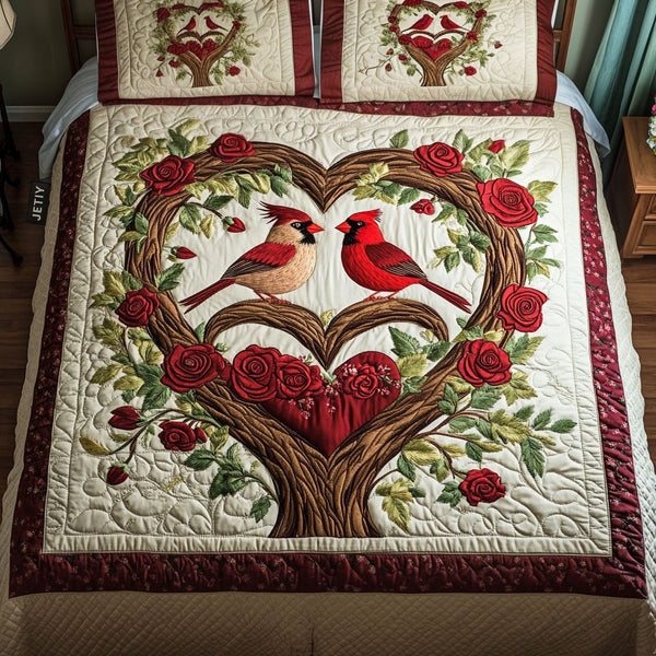 Cardinal Whisper quilted 3-piece bedding set on a made bed with two matching pillow shams