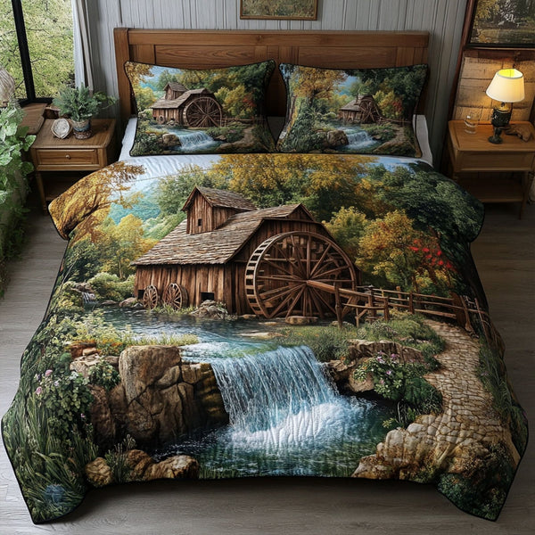 Cascade Haven quilted 3-piece bedding set on a made bed with two matching pillow shams