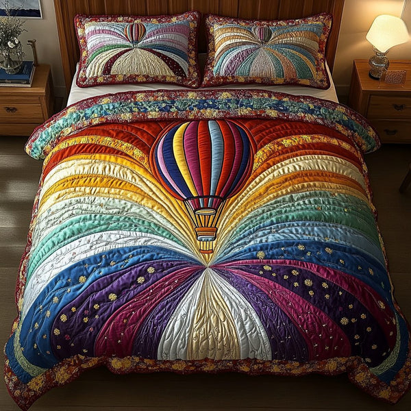 Celestial Lift quilted 3-piece bedding set on a made bed with two matching pillow shams