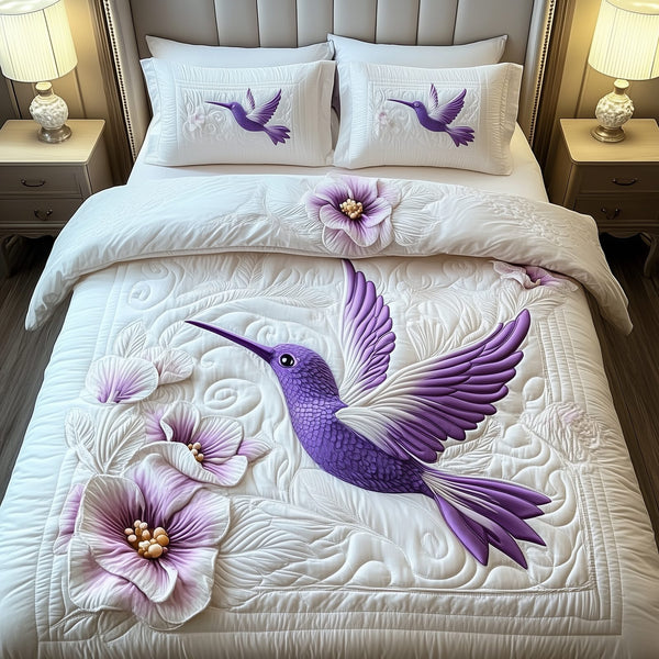 Charming Hummingbird quilted 3-piece bedding set on a made bed with two matching pillow shams
