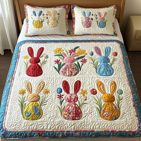 Cheerful Bunny Blooms quilted 3-piece bedding set on a made bed with two matching pillow shams