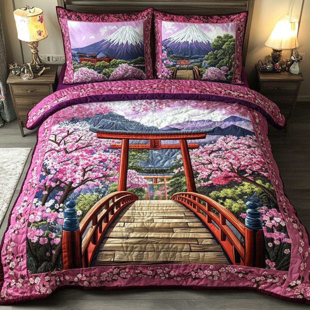Cherry Blossom Peak quilted 3-piece bedding set on a made bed with two matching pillow shams