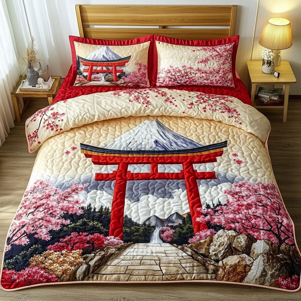 Cherry Blossom Shrine quilted 3-piece bedding set on a made bed with two matching pillow shams