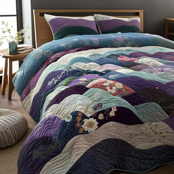 Cherry Grove quilted 3-piece bedding set on a made bed with two matching pillow shams