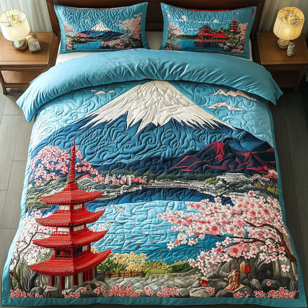 Cherry Tranquil quilted 3-piece bedding set on a made bed with two matching pillow shams