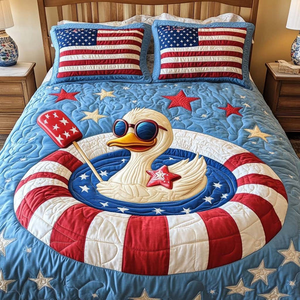 Chill Duck Float quilted 3-piece bedding set on a made bed with two matching pillow shams