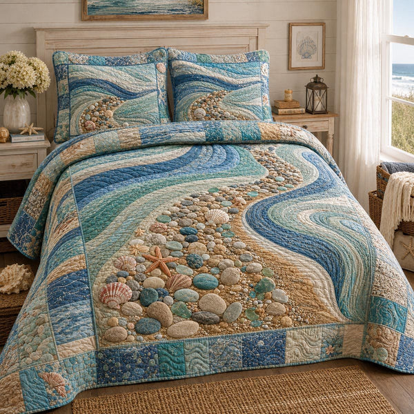 Coastal Breeze quilted 3-piece bedding set on a made bed in a light coastal bedroom