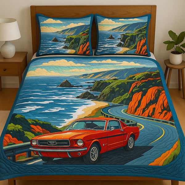 Coastal Cruise quilted 3-piece bedding set on a made bed in a light coastal bedroom