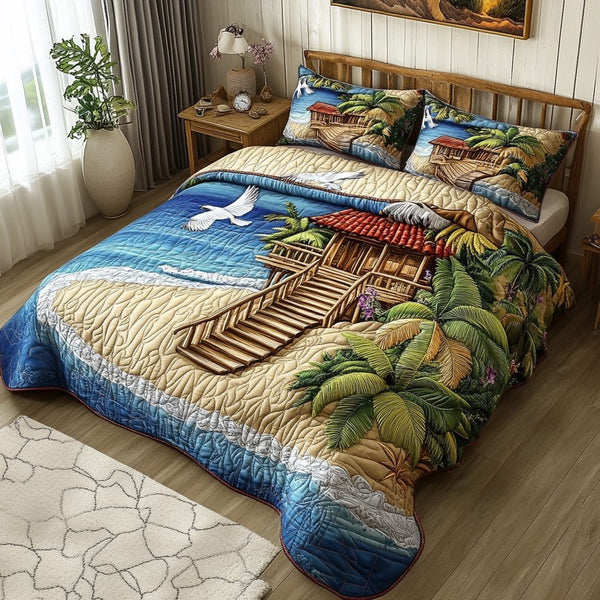 Coastal Escape quilted 3-piece bedding set on a made bed in a light coastal bedroom