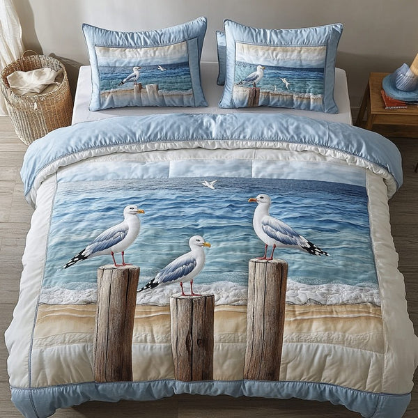 Coastal Flight quilted 3-piece bedding set on a made bed in a light coastal bedroom