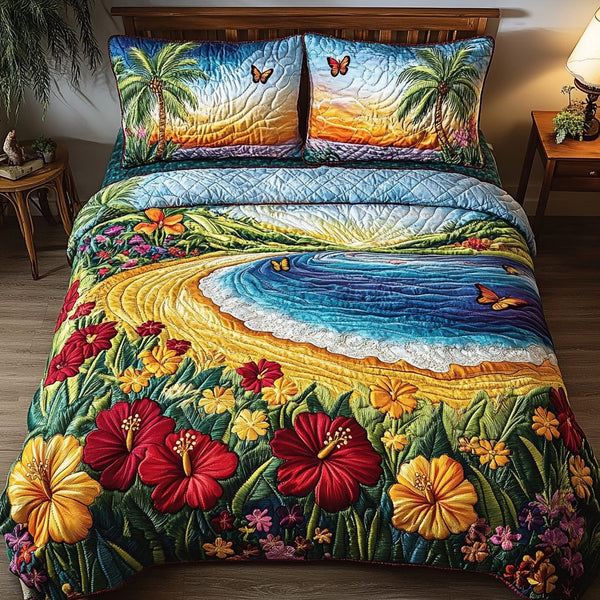Coastal Glow quilted 3-piece bedding set on a made bed in a light coastal bedroom
