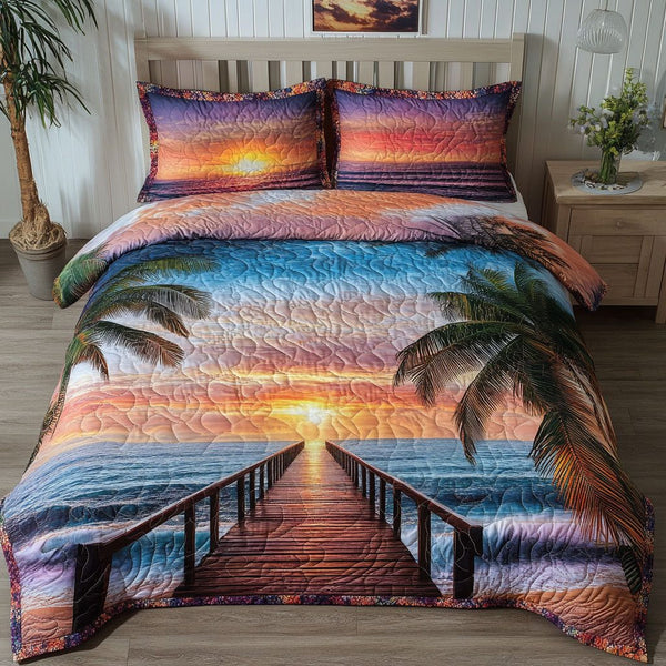 Coastal Paradise quilted 3-piece bedding set on a made bed in a light coastal bedroom