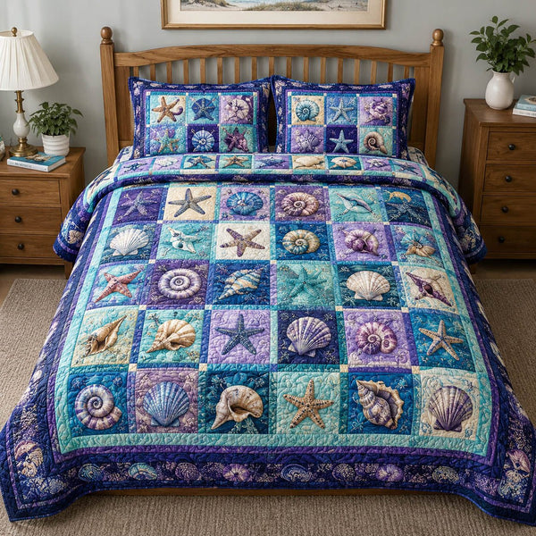 Coastal Seashell quilted 3-piece bedding set on a made bed in a light coastal bedroom