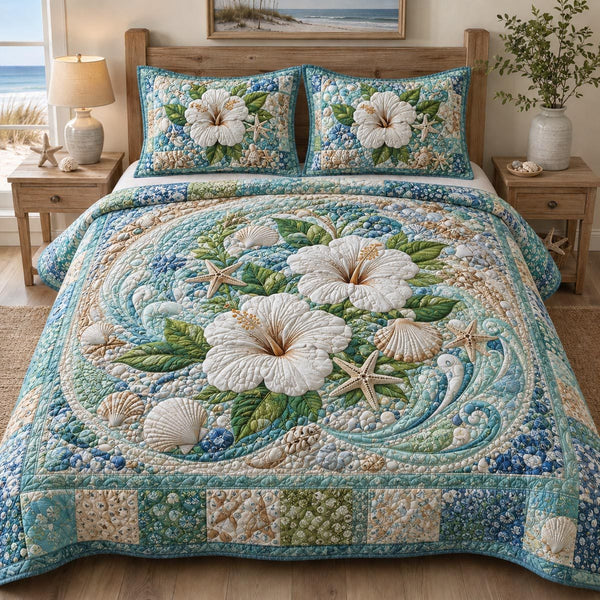 Coastal Serenity quilted 3-piece bedding set on a made bed in a light coastal bedroom