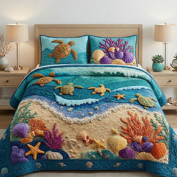 Coastal Shells quilted 3-piece bedding set on a made bed in a light coastal bedroom