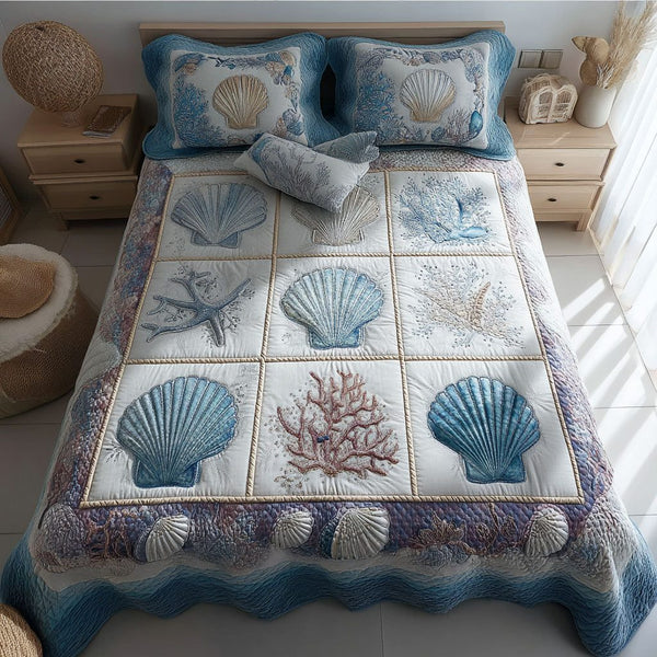 Coastal Shells quilted 3-piece bedding set on a made bed in a light coastal bedroom