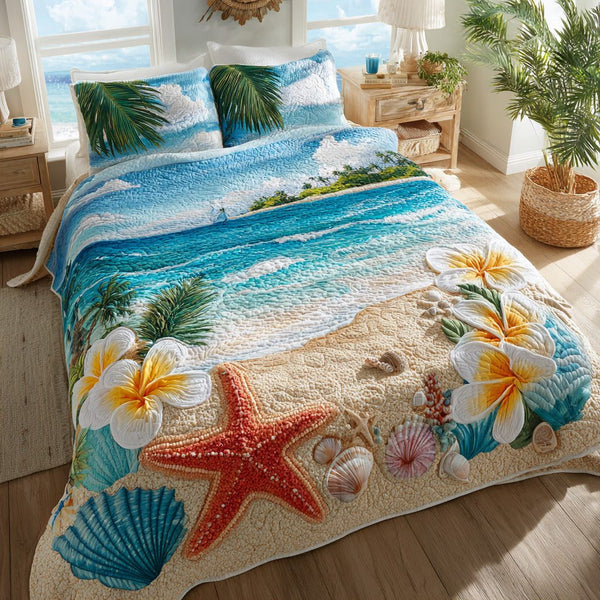 Coastal Shells quilted 3-piece bedding set on a made bed in a light coastal bedroom