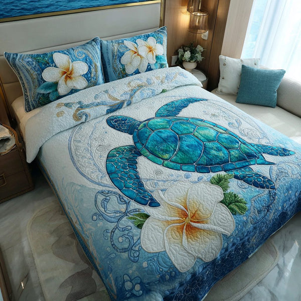 Coastal Turtle quilted 3-piece bedding set on a made bed in a light coastal bedroom