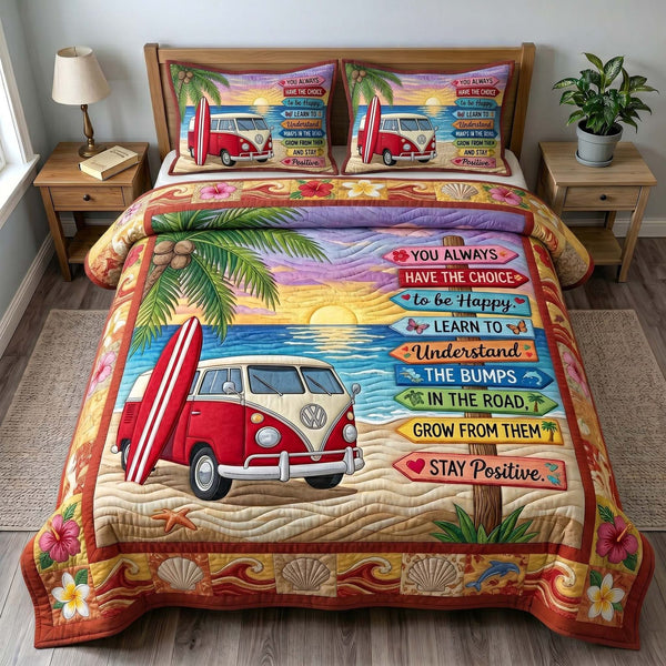 Coastal Wanderer quilted 3-piece bedding set on a made bed in a light coastal bedroom