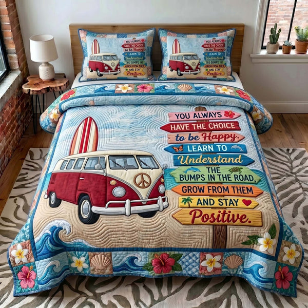 Coastal Wanderer quilted 3-piece bedding set on a made bed in a light coastal bedroom