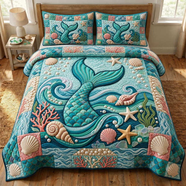Coastal Whisper quilted 3-piece bedding set on a made bed in a light coastal bedroom