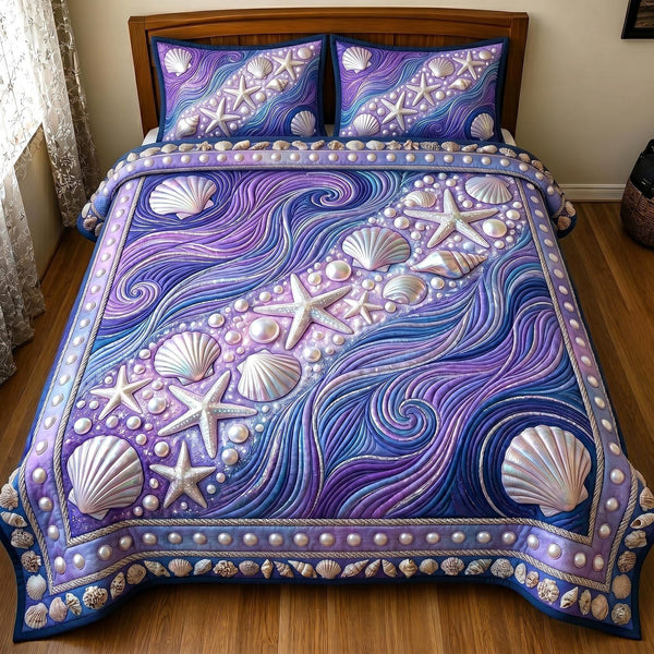 Coastal Whisper quilted 3-piece bedding set on a made bed in a light coastal bedroom