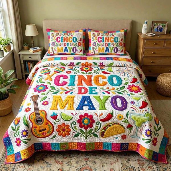 Color Tiles quilted 3-piece bedding set on a made bed with two matching pillow shams
