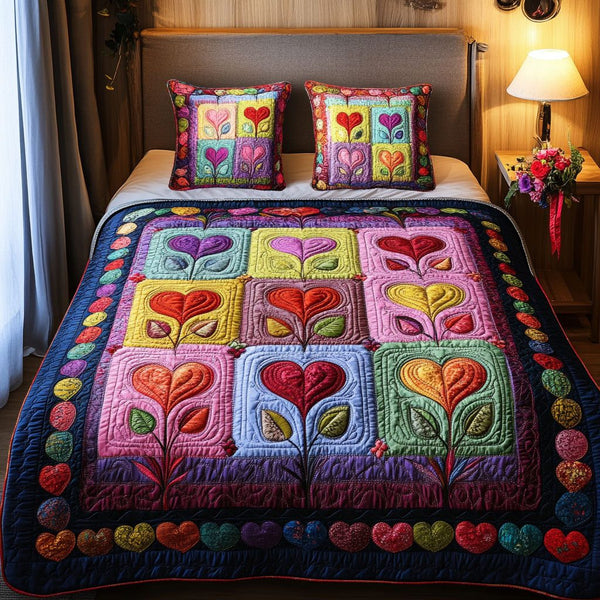 Colorful Bliss quilted 3-piece bedding set on a made bed with two matching pillow shams