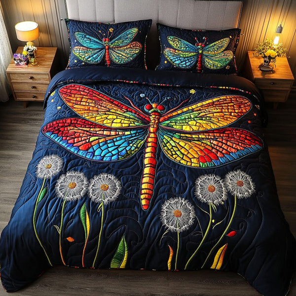 Colorful Flight quilted 3-piece bedding set on a made bed with two matching pillow shams