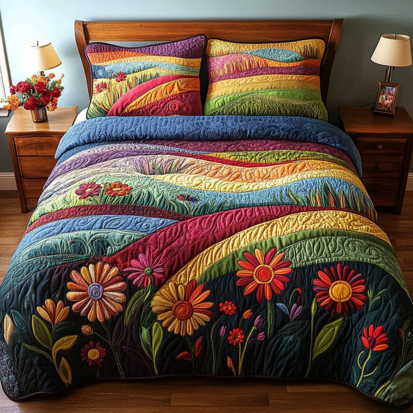 Colorful Flower Field quilted 3-piece bedding set on a made bed with two matching pillow shams