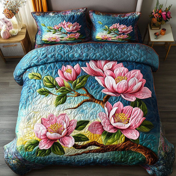 Colorful Magnolia Garden quilted 3-piece bedding set on a made bed with two matching pillow shams