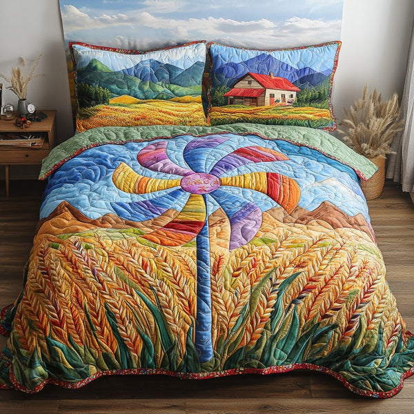 Colorful Pinwheel quilted 3-piece bedding set on a made bed with two matching pillow shams