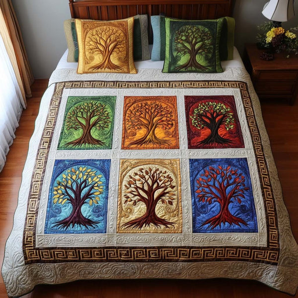 Colorful Roots quilted 3-piece bedding set on a made bed with two matching pillow shams