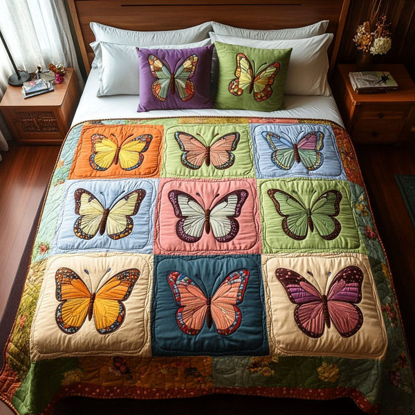 Colorful Wing Mosaic quilted 3-piece bedding set on a made bed with two matching pillow shams