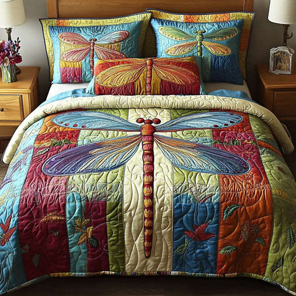Colorful Wings quilted 3-piece bedding set on a made bed with two matching pillow shams