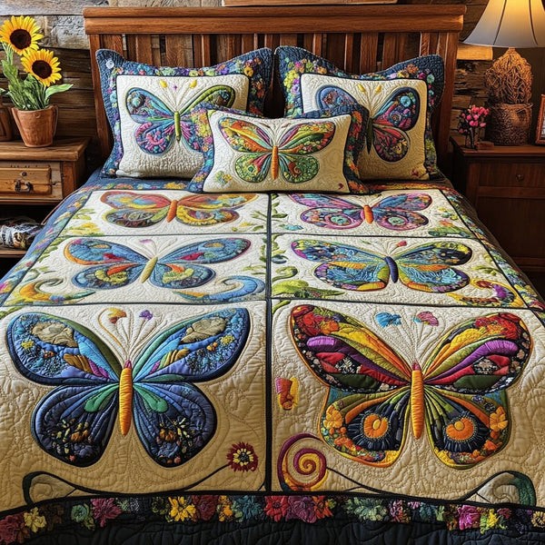 Colorful Wings quilted 3-piece bedding set on a made bed with two matching pillow shams