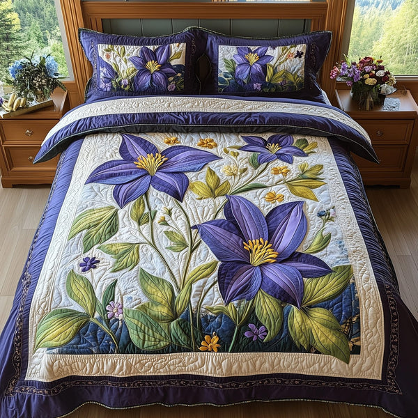 Columbine Charm quilted 3-piece bedding set on a made bed with two matching pillow shams