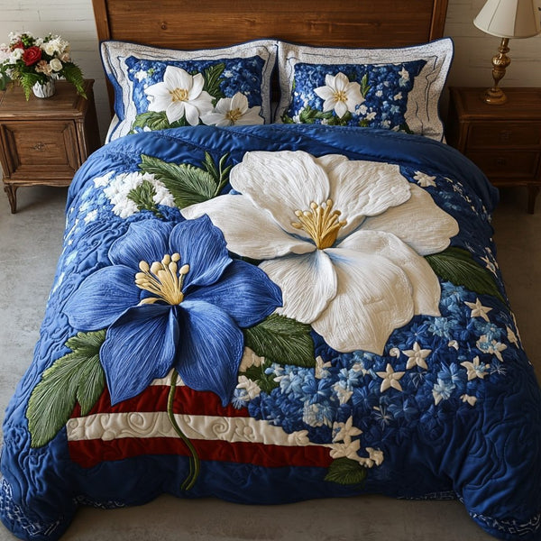 Columbine Garden quilted 3-piece bedding set on a made bed with two matching pillow shams