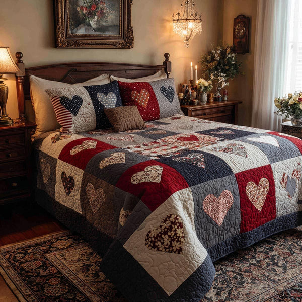 Comfort Hearts quilted 3-piece bedding set on a made bed with two matching pillow shams