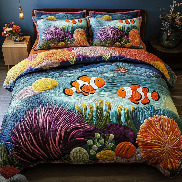 Coral Bliss quilted 3-piece bedding set on a made bed in a light coastal bedroom