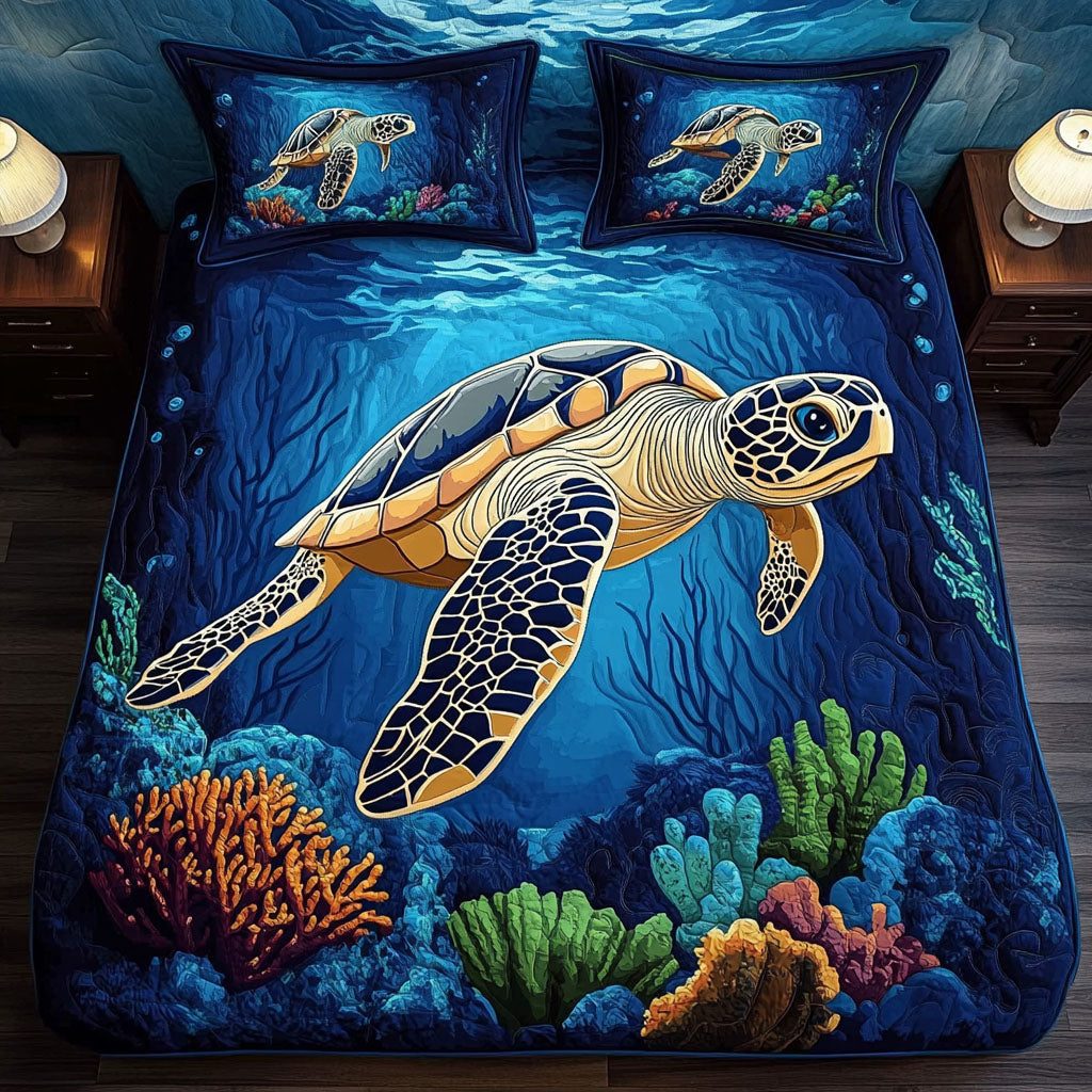 Coral Explorer quilted 3-piece bedding set on a made bed in a light coastal bedroom