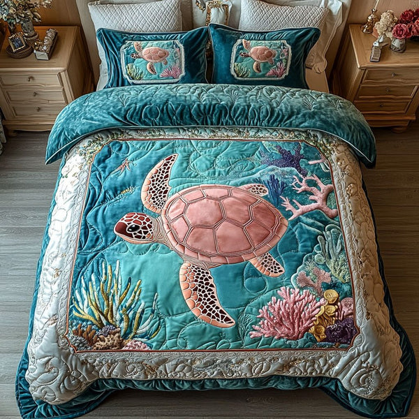 Coral Explorer quilted 3-piece bedding set on a made bed in a light coastal bedroom
